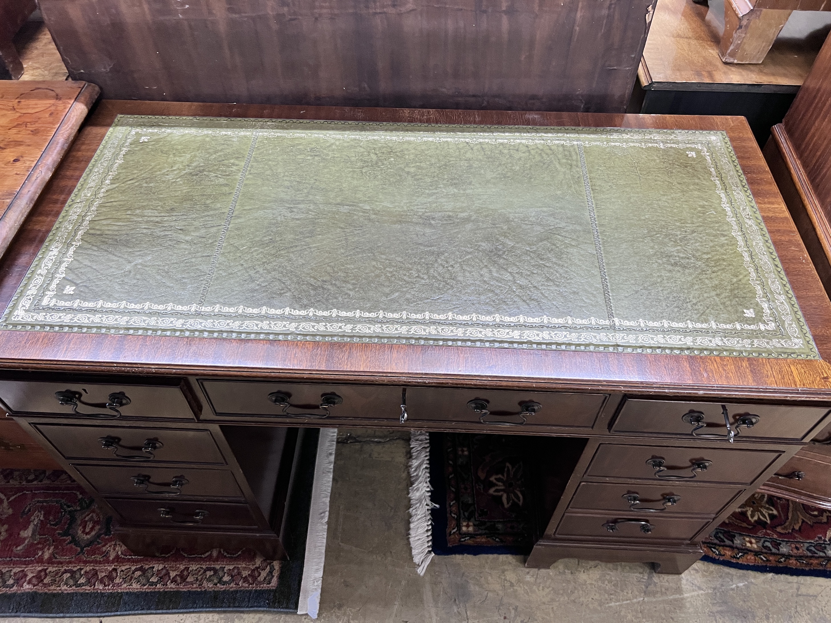 A reproduction mahogany pedestal desk, width 122cm